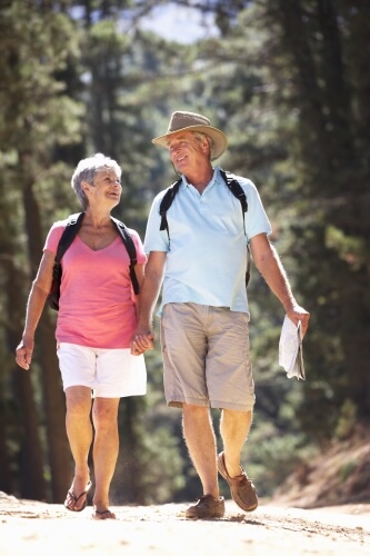 Optimized-Fit-senior-couple-walking-outdoors-getting-exercise-1.jpg